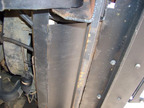 1990 Ford Bronco - Underbody view showing frame structure and some fluid lines. Supermotors.net watermark is present.