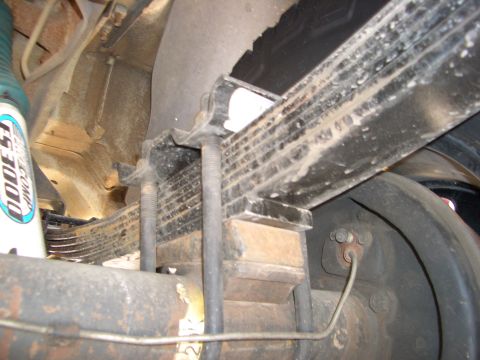 1990 Ford Bronco - Close-up view of the rear suspension components of a vehicle.