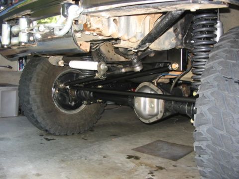 1995 Ford Bronco - Custom suspension and axle work on a vehicle, focusing on off-road modifications.
