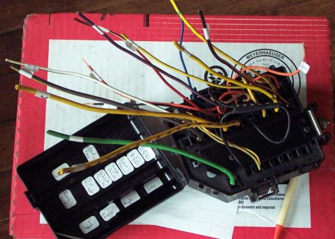1985 Ford Crown Victoria LTD - A close-up shows a disassembled fuse box with many colored wires and handwritten labels on the cover.
