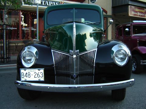 1990 Ford Thunderbird - This classic Ford truck features a prominent chrome grille and distinctive rounded fenders.