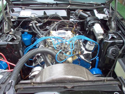 1970 Ford Ranchero - The engine bay is clean with blue accents on the wiring and fluid reservoirs.