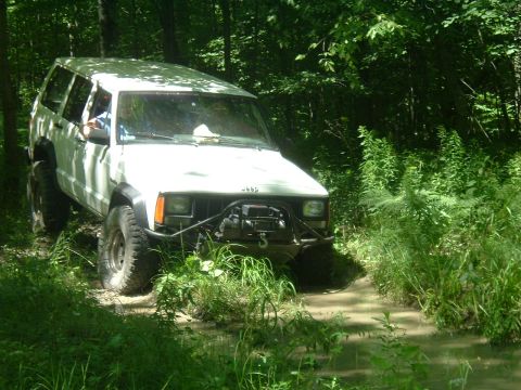 1982 Ford Bronco - My mom's Cherokee. That's the bumper dad built this spring.