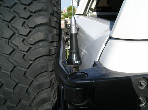 1993 Ford Bronco - Detail of a spare tire and antenna mount, an 'ES' logo and a Supermotors.net watermark.