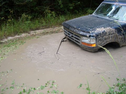 1990 Ford Bronco - This 1990 Ford Bronco is stuck deep in the mud.