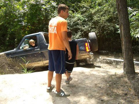 1990 Ford Bronco - A 1990 Ford Bronco is stuck in the mud off-road.
