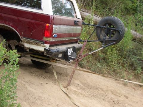1990 Ford Bronco - Ford Bronco using a Hi-Lift jack to get unstuck from a dirt embankment.