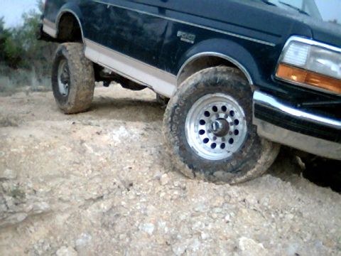 1992 Ford Bronco - This lifted 1992 Ford Bronco navigates a rough, rocky terrain.