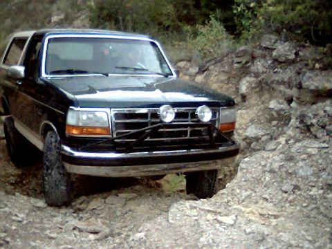 1992 Ford Bronco - This 1992 Ford Bronco navigates a challenging off-road trail.