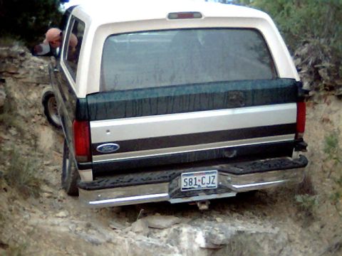 1992 Ford Bronco - A 1992 Ford Bronco navigates a challenging rocky terrain.