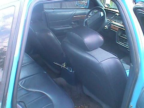 1994 Ford Crown Victoria - Interior view of a 1994 Ford Crown Victoria, highlighting the seats and dashboard.