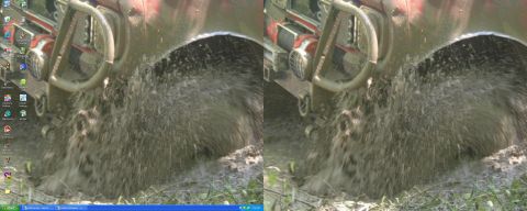 1988 Ford Bronco - A vehicle's tire digs into thick mud, spraying it everywhere.