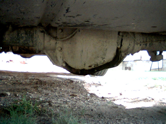Underside view of a vehicle's rear differential and axle