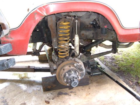 1978 Ford Bronco - Close-up view of the front suspension and wheel hub assembly on a 1978 Ford Bronco.