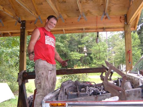 1978 Ford Bronco - Man works on a car engine, with the Supermotors.net logo visible in the lower right corner.