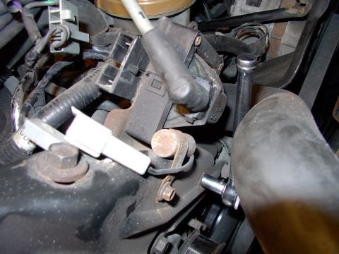 1990 Lincoln Town Car - Just a pair of 8mm bolts is all that holds the stock coil bracket in, after you've gently wiggled off the two signal wires in the harness p…