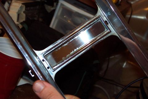 1985 Ford Crown Victoria LTD - Close-up of a chrome trim part, likely from a car's interior or exterior.