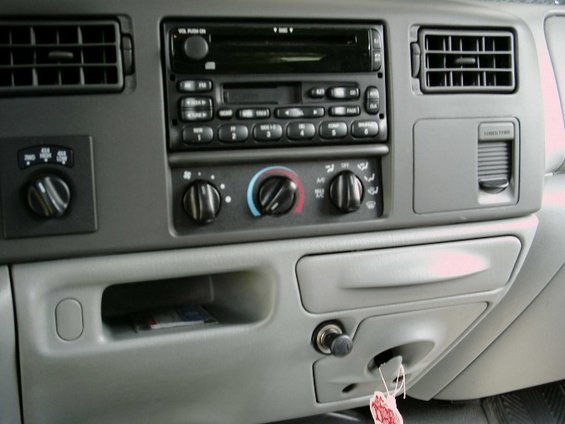Ford truck center dash with cassette radio, rotary climate controls and glovebox