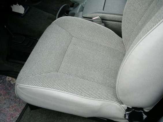 Gray ribbed cloth bucket seat bottom cushion in a truck cab