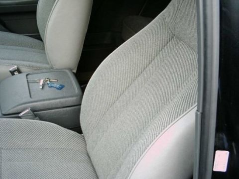1992 Ford Bronco - Interior view of a vehicle's seats and center console, with keys resting on top.