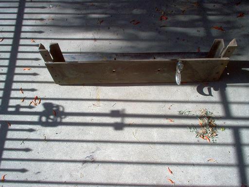 Winch bumper mount with U-bolt and bracket on concrete