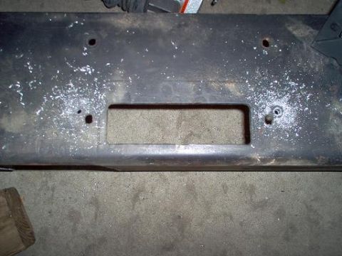 1988 Ford Bronco - Close-up of a winch mounting plate, likely for a truck or SUV, showing wear and mounting points.