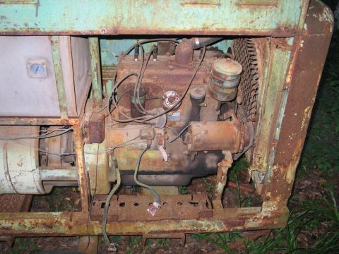 2004 Ford F-150 - Close-up view of a heavily rusted engine, likely from a piece of industrial equipment.