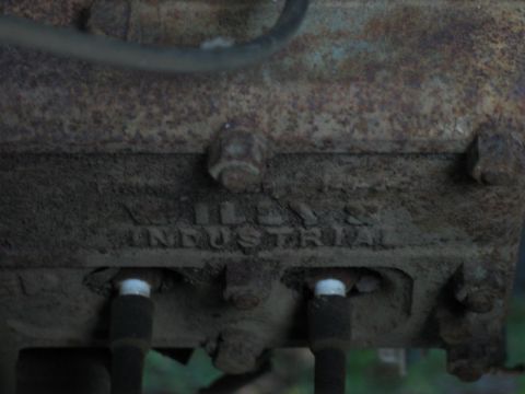 2004 Ford F-150 - The engine block has 'WILLYS INDUSTRIAL' cast into the metal. The year is not visible.