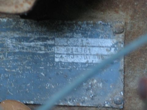 2004 Ford F-150 - A close-up view of a vehicle identification plate, showing stamped alphanumeric characters.