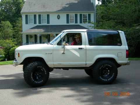 1984 Ford Bronco II - White 1984 Ford Bronco II parked in front of a house.
