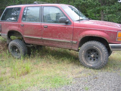 1991 Ford Explorer - This red 1991 Ford Explorer has been lifted and fitted with off-road tires.