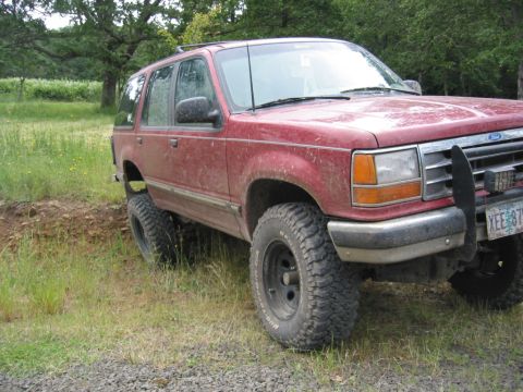 1991 Ford Explorer - This lifted 1991 Ford Explorer is shown off-road, demonstrating its off-road capabilities.