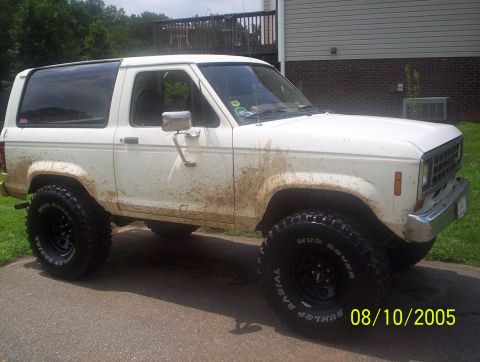 1984 Ford Bronco II - This 1984 Ford Bronco II shows signs of recent off-roading, with mud splattered on its sides and fenders.