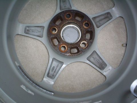 1994 Lincoln Mark VIII - A car wheel is shown up close, revealing its internal structure and some signs of wear.