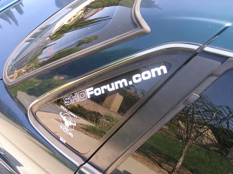 1993 Ford Taurus - A close-up of a car's rear window shows two decals, one for SHOForum.com and another for West Coast TCCA.