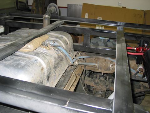 1981 Ford Bronco - Close-up view of the fuel tank and chassis components, with no clear year identification.