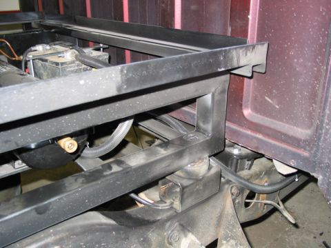 1981 Ford Bronco - Custom frame modifications are visible beneath the vehicle, including the battery placement and wiring.