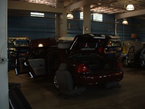 1999 Ford Crown Victoria - Dark Toreador Red 2005 Ford Crown Vic Police Interceptor getting outfitted for duty.