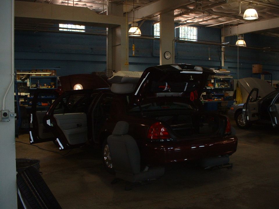 Dark Toreador Red 2005 Ford Crown Vic Police Interceptor getting outfitted for duty.