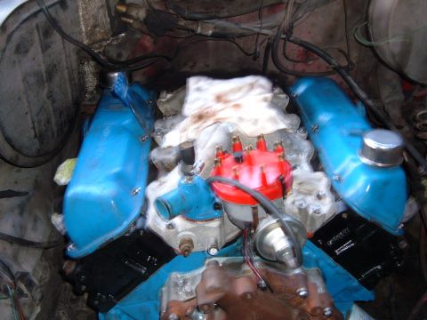 1978 Ford Bronco - Close-up view of an engine's internal components, including valve covers and distributor.