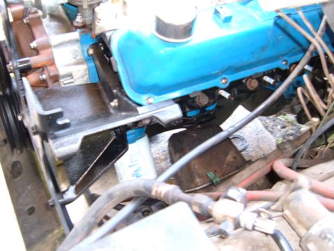 1978 Ford Bronco - Close-up view of an engine bay blue valve covers and spark plugs, with visible hoses and engine components.