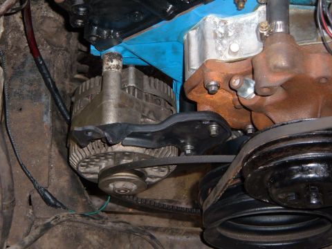 1978 Ford Bronco - Engine bay detail showing an alternator and associated drive belts.