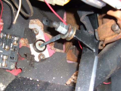 1978 Ford Bronco - Close-up view of the clutch pedal linkage and fuse box assembly.