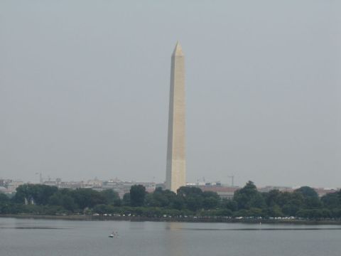 1986 Ford Bronco - The Washington Monument stands tall against a hazy sky, with the Potomac River and city skyline visible.