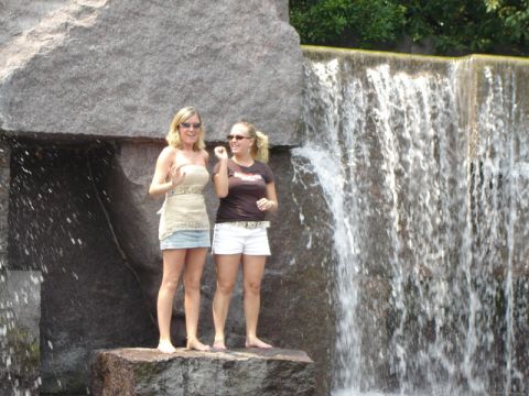 1986 Ford Bronco - Two women pose for a photo near a waterfall, with a large rock formation to their left.
