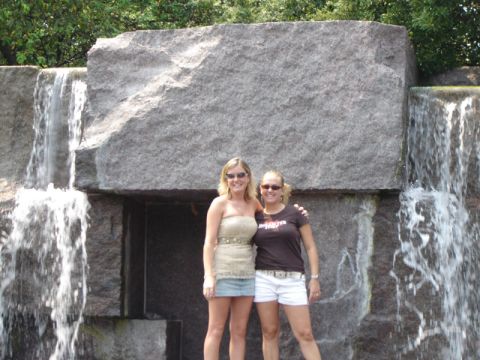 1986 Ford Bronco - Two women pose for a photo in front of a large stone structure with water cascading down its sides.