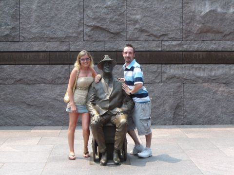 1986 Ford Bronco - Two people stand with a bronze statue of Franklin D. Roosevelt seated in a wheelchair.