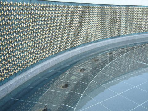 1986 Ford Bronco - The Vietnam Veterans Memorial Wall features thousands of stars, with their reflections visible in the surrounding water feature.