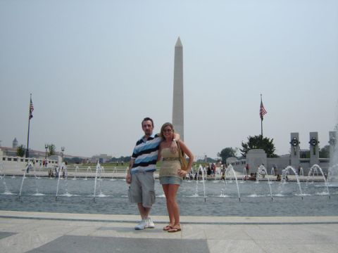 1986 Ford Bronco - A couple stands in front of the World War II Memorial in Washington D.C., with the Washington Monument visible in the distance.