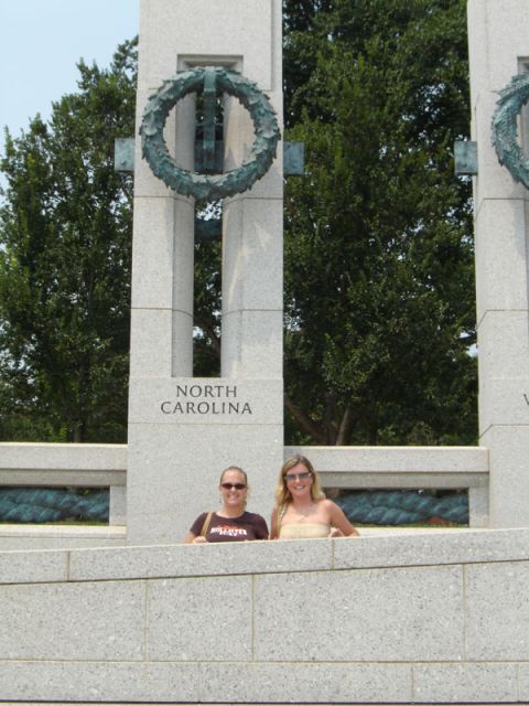 1986 Ford Bronco - Two individuals pose at the World War II Memorial, with the inscription "NORTH CAROLINA" visible on one of the pillars.